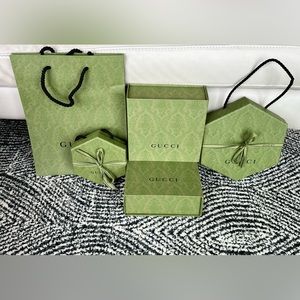 4 Gucci Boxes and 1 bag.
